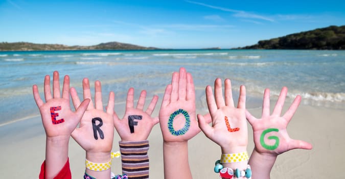 Children Hands Building Colorful German Word Erflog Means Success. Summer Ocean, Sea And Beach As Background