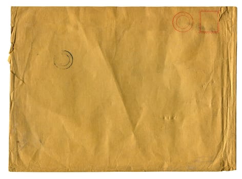 front view closeup of blank old aged closed letter paper envelope with torn edges and faded stamp print isolated on white background
