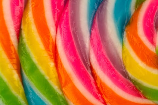 closeup macro detail of colorful lollipop candy texture pattern  isolated on white background