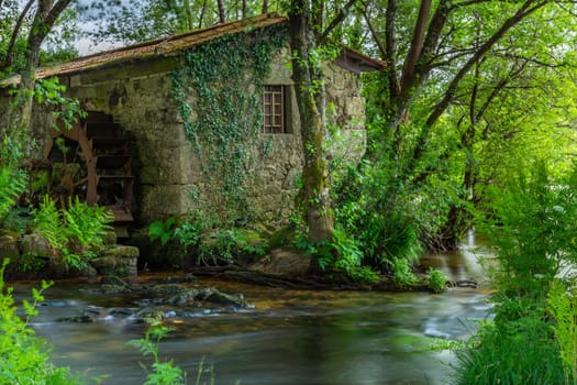 Long exposure near an ancient watermill in Cavado river, Braga, Portugal