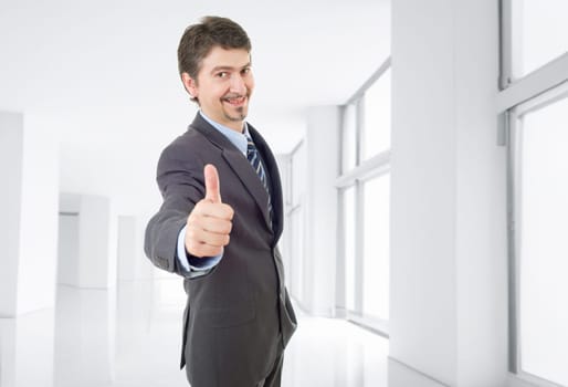 young business man going thumb up, at the office