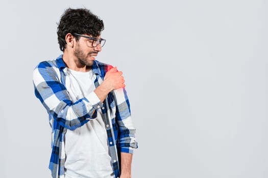 Man suffering from upper arm inflammation. Arm and shoulder pain concept. People with upper arm pain isolated, muscle tension problems, Man with upper arm muscle pain