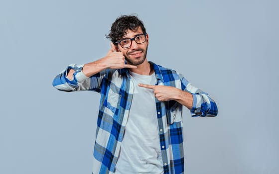 Interpreter man gesturing CALL ME in sign language. Person gesturing CALL ME in sign language, Young man gesturing CALL ME in sign language. Manual gestures of people with hearing problems