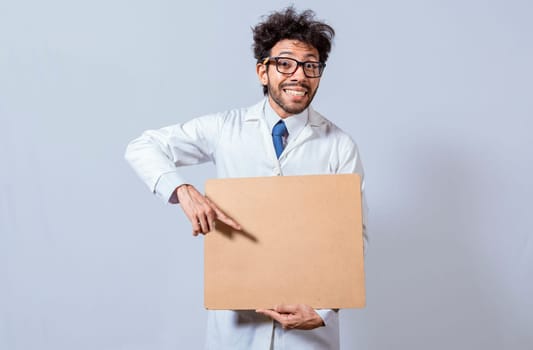 Professor in white coat holding a blank clipboard isolated. A scientist in a white coat is holding a blank clipboard. Scientist showing and pointing at a blank clipboard