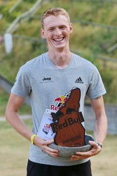 Bastian Glöden has a good laugh and is happy about third place at the Red Bull 400 - Germany premiere Titisee-Neustadt