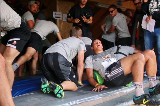Exhausted but happy,the participants of the final at the Red Bull 400 - Germany premiere Titisee-Neustadt are in the finish of the start house of the Hochfirstschanze