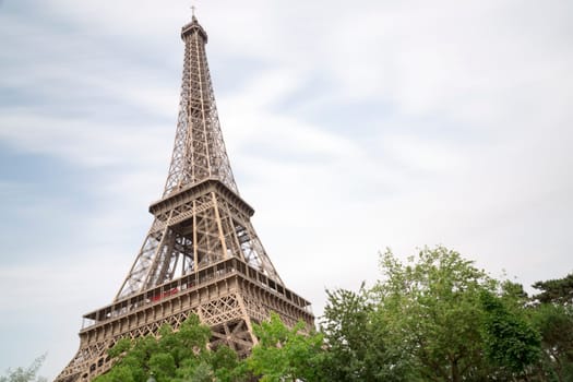 Eiffel Tower in Paris, France with trees in front of it.