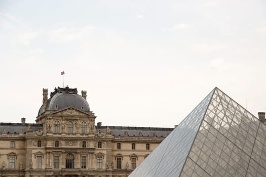 The Louvre in Paris, France with it's glass pyramid.