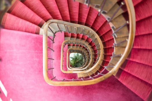 Down the Staircase with red carpeting.