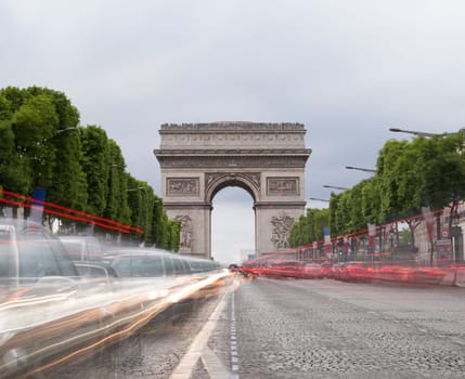 Arch of Triumph in Paris, France with light trails from cars.