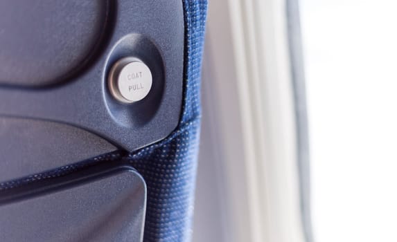 Air Plane Coat Hanger on a blue seat.