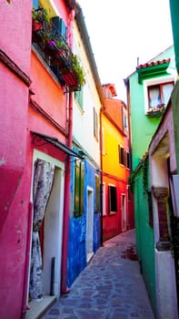 Burano colorful building architecture in alley, Venice, Italy