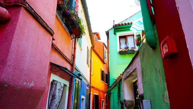 Burano colorful building architecture in alley, Venice, Italy