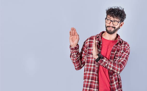 Displeased intense man with rejection gesture, pulls palms in rejection, frowns in disgust. Displeased person rejecting with rejection gesture, throw palms isolated