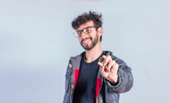 Smiling man holding bitcoin coin, Handsome man showing bitcoin coin, Person holding bitcoin coin isolated