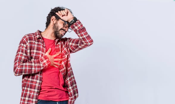 Man with heart pain on isolated background, man with chest pain isolated, man with tachycardia, young man with chest pain isolated