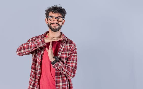 A man gesturing time out, Man doing time out gesture, latin guy doing time out gesture