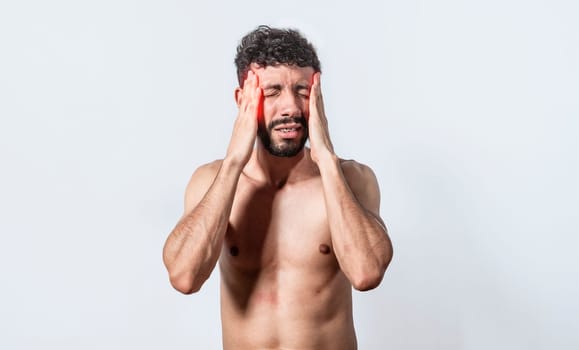 Shirtless man with headache, person with headache on isolated background, man in pain holding his head, migraine man concept