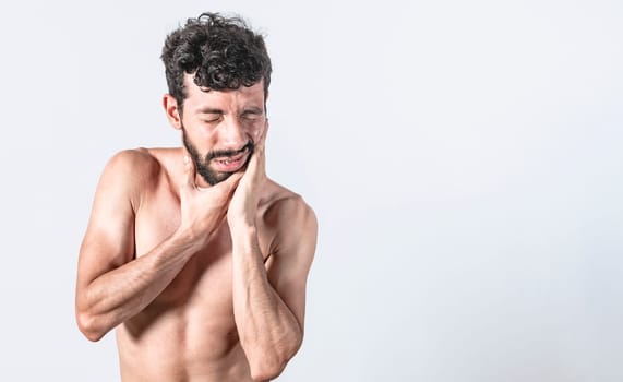 Man with earache on isolated background, ear disease concept, Person with earache on isolated background