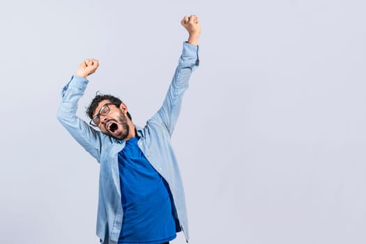 Beard man yawning and stretching his hands, sleepy man stretching his hands isolated, concept of a sleepy exhausted man