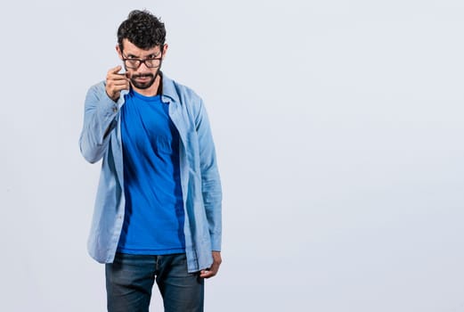 Hey you, be careful. bearded guy looking angry and warning, angry man threatening finger at camera, concept of angry person threatening head on