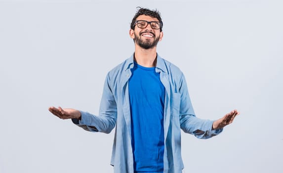 Generous man with open arms, Man sharing open hands looking at the camera with a friendly smile, Man welcoming head-on