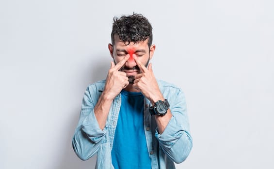 People with pain touching nose. Handsome man with nasal bridge pain, Man with nasal bridge headache. Sinus pain concept