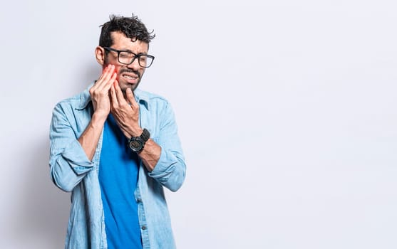 A man suffering from toothache isolated, People with toothache, person with hand on cheek with toothache. Concept of people with periodontitis