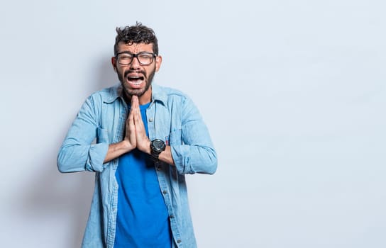 Man worried asking please, People putting hands together asking please, worried man apologizing, Hopeful man asking for help or apologizing, man thanking for forgiveness