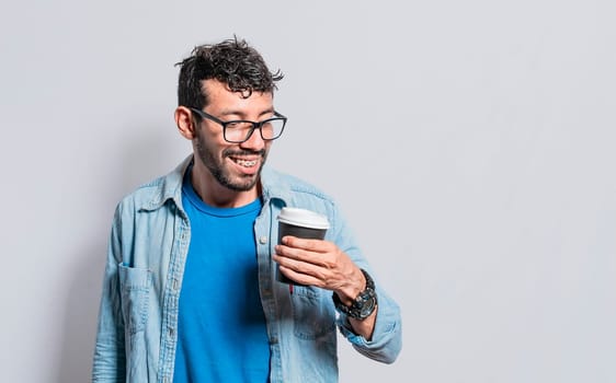 Excited person holding coffee glass on isolated background, Excited young man holding paper coffee cup, Excited man with coffee glass