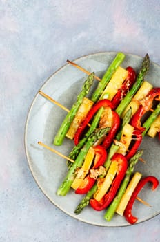 Shish kebabs with bell peppers, green asparagus, cheese. Summer barbecue food.
