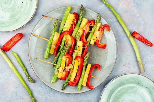 Shish kebabs with bell peppers, green asparagus, cheese. Summer barbecue food.