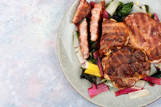 Roast meat steak with a vegetable garnish.