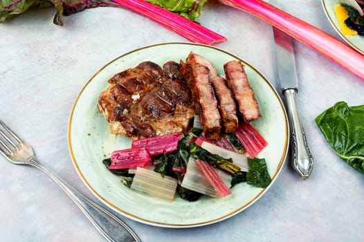 Delicious grilled meat steak and fresh herb salad
