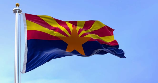 The flag of Arizona waving in the wind on a clear day. Copper star, 13 rays of red and yellow, and a blue bottom half. 3d illustration render. Fluttering textile
