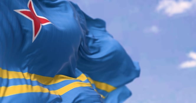 Flag of Aruba waving in the wind on a clear day. Light blue field, 2 yellow stripes, 4-pointed red star. Colors represent sea, abundance, peace, and origins. 3d illustration render. Selective focus