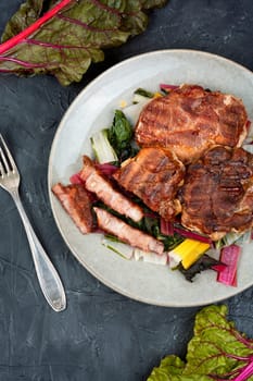 Delicious grilled meat steak and fresh herb salad