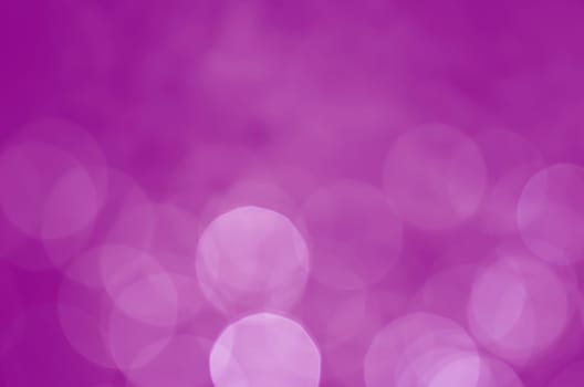 Light abstract pink bokeh christmas circle color glitter blurred black background