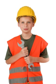 Front upper body view of a 10 year old boy wearing an orange safety vest and holding a large open-end wrench in front of him isolated on white.