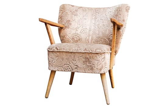 Three-quarter view of a vintage armchair with hardwood armrests and worn upholstery isolated on white.