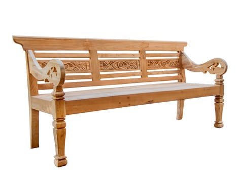 Three quarter view of a softwood garden bench with an ornate back, armrests and legs isolated on white.