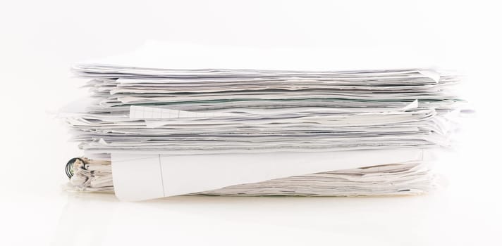 Large pile of waste paper isolated on white, ready for recycling.