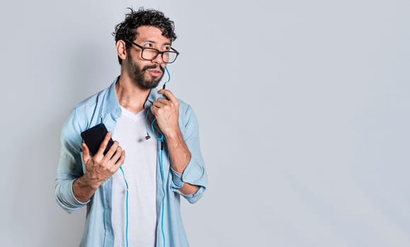 handsome man using handsfree while calling on cellphone, Person using handsfree on a cellphone call isolated, people on a call using handsfree