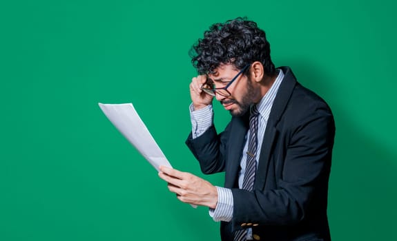 Businessman puzzled with documents in hand isolated, Confused businessman with documents in hand, Concept of man in formal suit frustrated with documents in hand