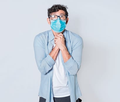 Latin man begging with medical protective face mask. pleading man concept isolated, man asking for a favor