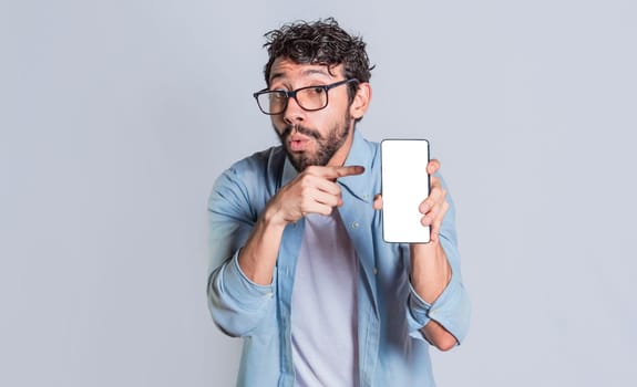 Amazed man showing mobile screen, Shocked person showing and pointing at his smartphone screen, Amazed people showing and pointing at blank cell phone screen