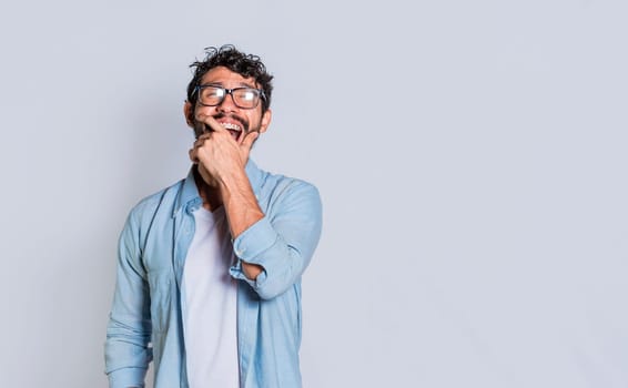 A person laughing out loud at a joke. Handsome man laughing out loud on isolated background, Young man laughing out loud isolated