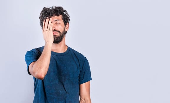 Exhausted person putting the palm of his hand on his face. Tired and exhausted man covering his face with the palm of his hand, Concept of a bored and tired man