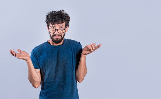 Man spreading palms, feeling clueless and uncertain, Person spreading hands bewildered, Concept of a puzzled man spreading hands