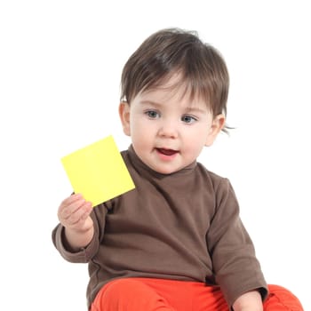 Baby showing a blank yellow note on a white isolated background
